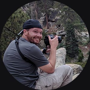 Portrait of Jason Coggeshall holding a camera