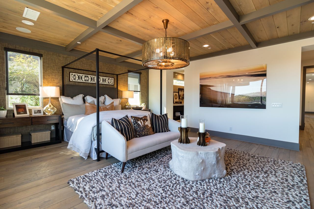 Bonus room with exposed wood beams and a lounge seating area