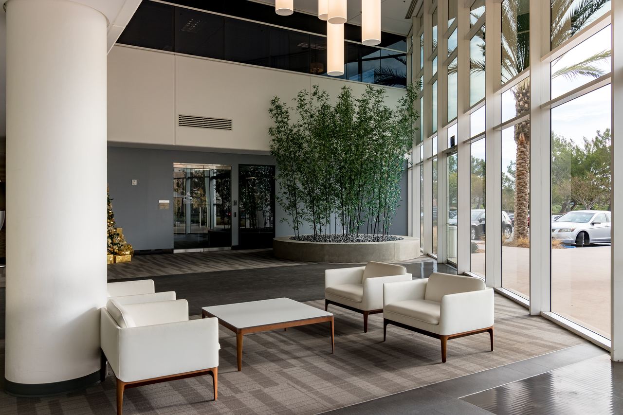Modern office lobby with lounge seating and glass walls