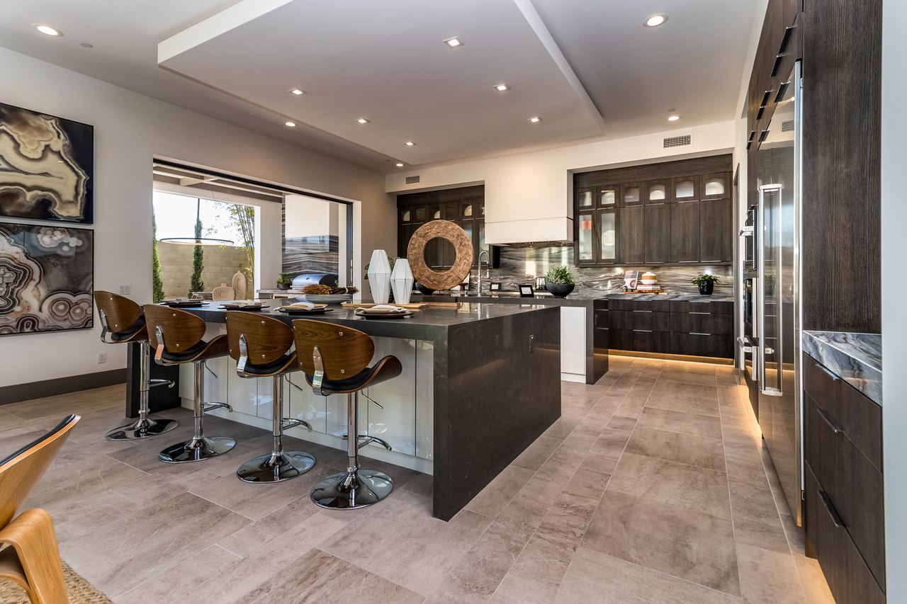 Modern kitchen with a waterfall island and bar seating