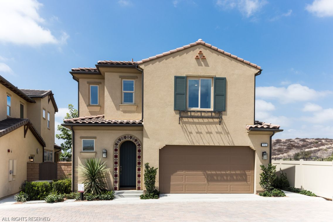 Finished exterior photo with a blue sky added